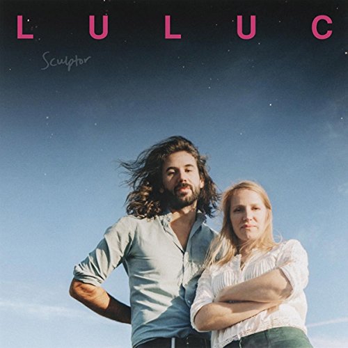 Album cover featuring a man and woman against a blue sky background.