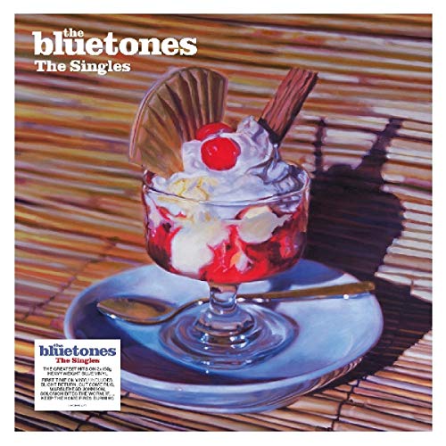 Album cover for The Bluetones’ “The Singles” featuring a dessert glass.