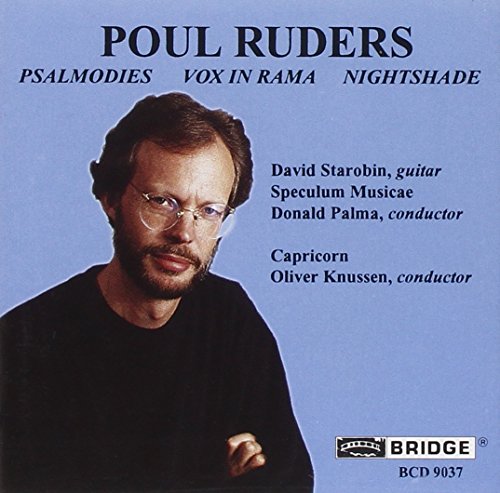 CD cover with a man in black shirt on blue background.
