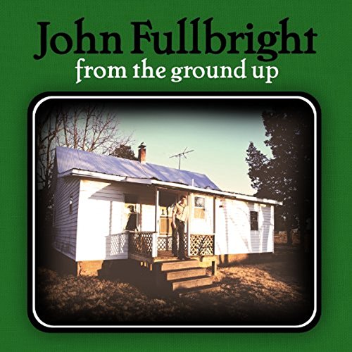 "Album cover with a small white house on green background."