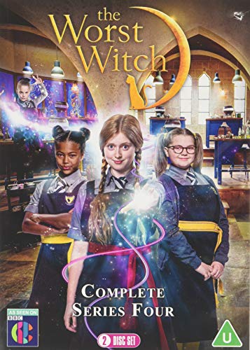 Three young witches in school uniforms stand in a classroom with magical light effects.