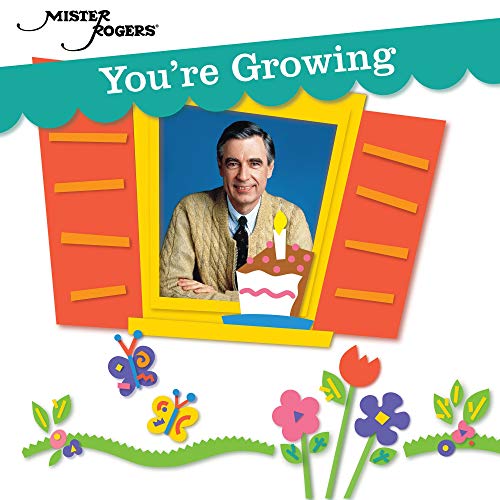 "Mister Rogers smiling in a window frame with a cake, surrounded by flowers and butterflies."