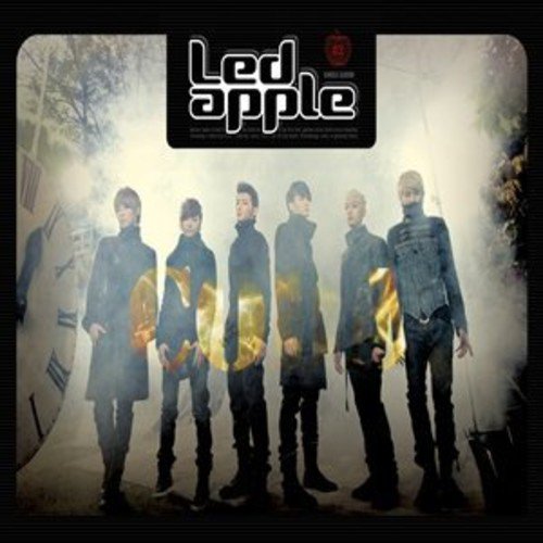 CD cover featuring six men in dark clothing, with a clock image.