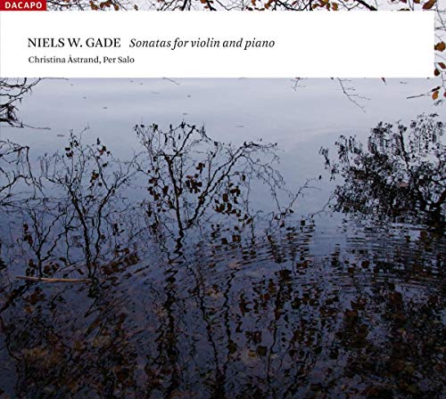 CD cover with a reflective water scene and bare branches.