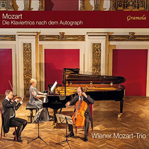 CD cover: musicians performing Mozart piano trios in a concert hall.