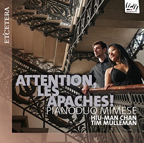 CD cover with two people by an ornate metal staircase.