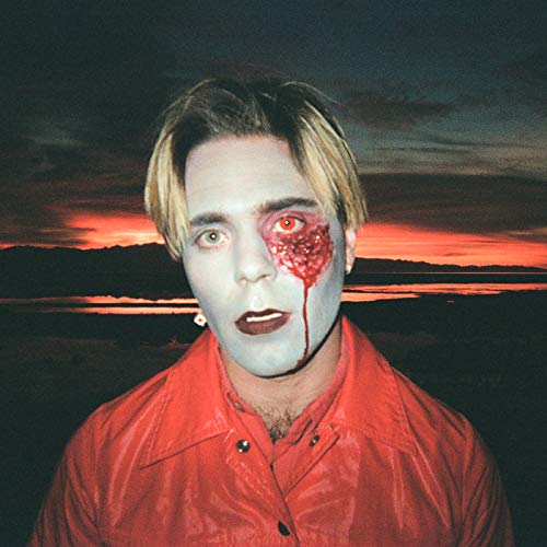 Pale-faced person with red markings, set against a fiery sunset.