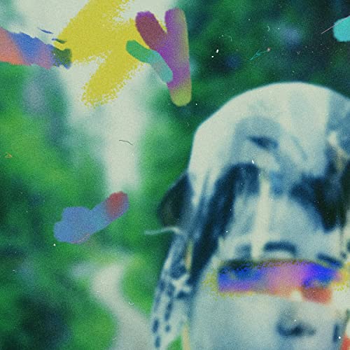 Abstract portrait with colorful paint splatters and blurred facial features.