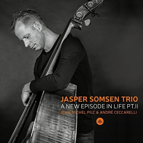 Black and white image of man holding double bass, with text overlay describing the album.