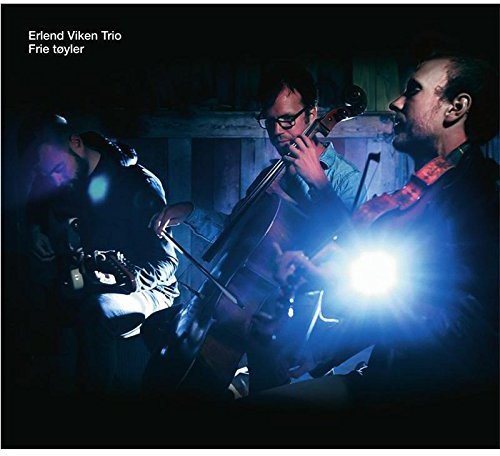 "CD cover featuring three musicians playing instruments in a dimly lit setting."