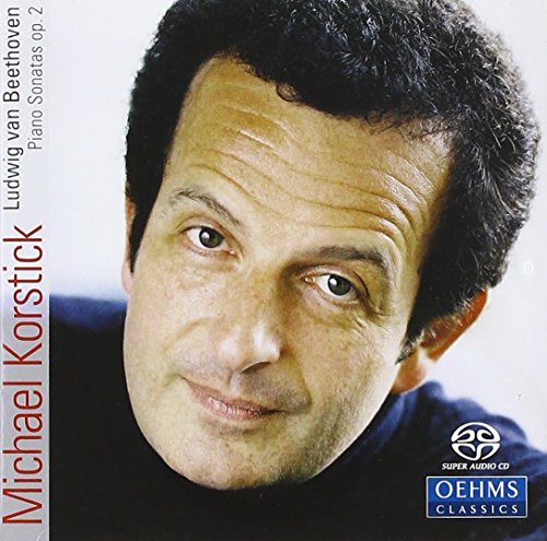 CD cover featuring a man's portrait with text and logos.