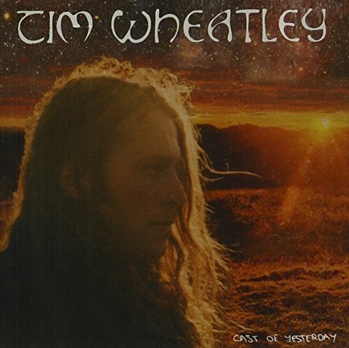 Album cover with Tim Wheatley's portrait against a sunset landscape with starry sky.