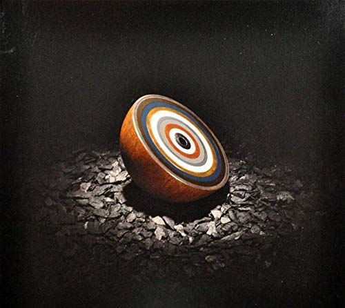 CD cover art: a colorful, layered sphere on dark, textured ground.