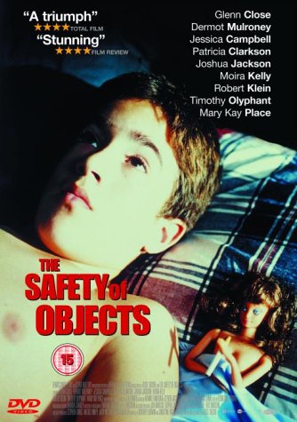 DVD cover for The Safety of Objects featuring a boy lying near a doll.
