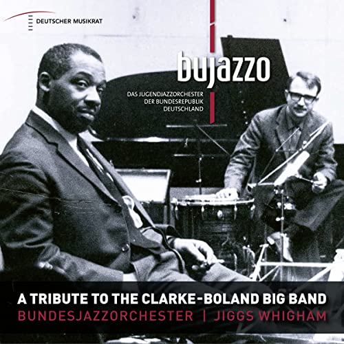 Black and white album cover featuring two men and a drum kit.