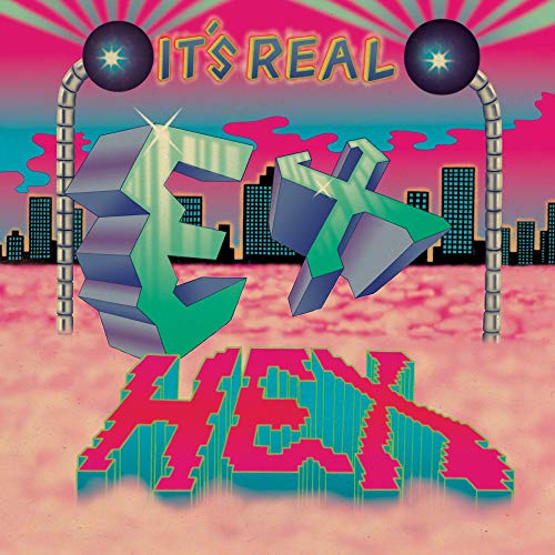 Album cover for Ex Hex’s “It’s Real” with 3D text and cityscape.