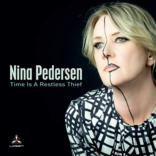 Nina Pedersen's album cover featuring a blonde woman with a black and white top.