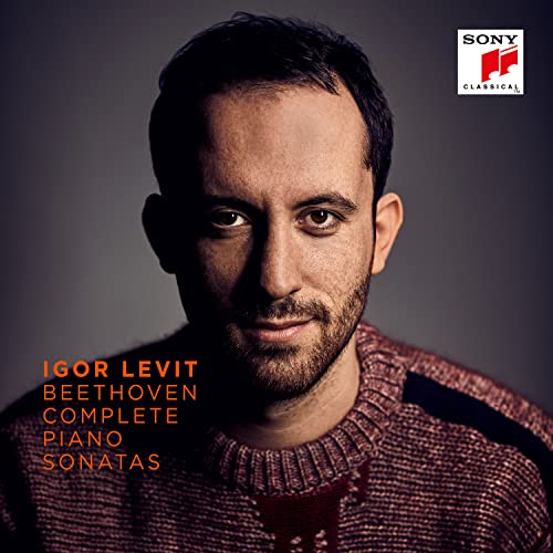 Close-up portrait of pianist Igor Levit with album title overlay.
