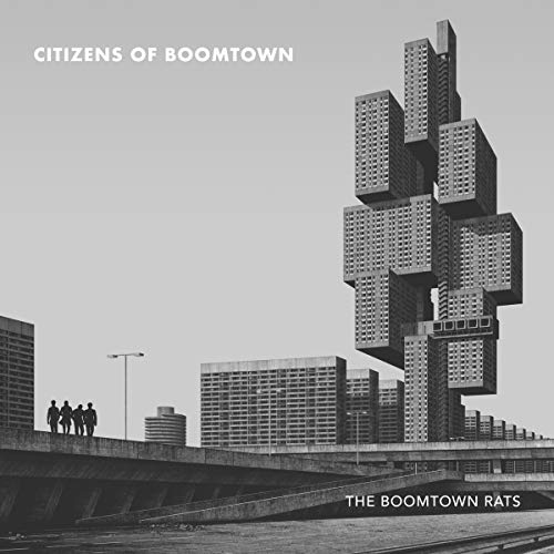 "Black and white album cover with futuristic cityscape and four silhouetted figures on a bridge."