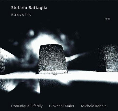 A black-and-white album cover featuring a close-up of a piano hammer.