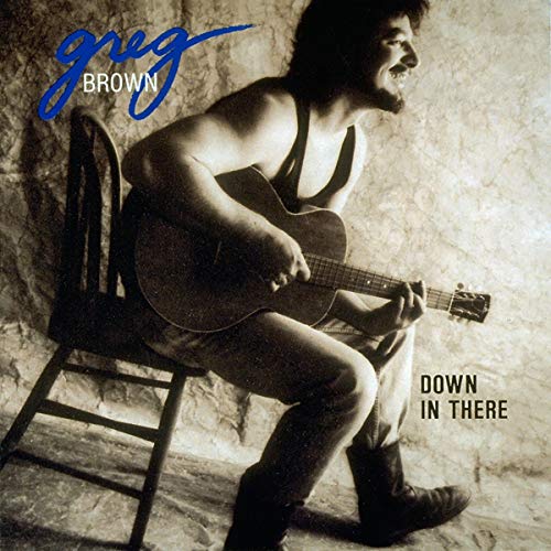 Greg Brown playing acoustic guitar, album cover for "Down In There.