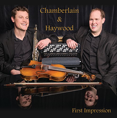 CD cover featuring two smiling men with musical instruments and reflections.
