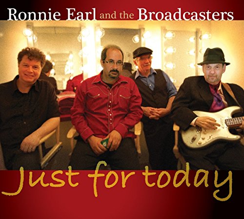 "CD cover with four men, one holding a guitar, in a dressing room."