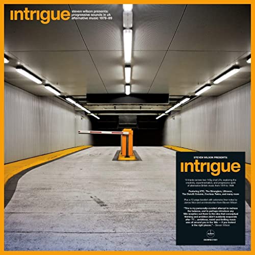 Vinyl record cover: a stark parking garage with a barrier arm raised.