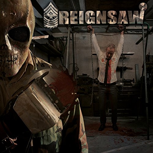 A man hangs from chains, bloody, as a masked figure stands beside him.