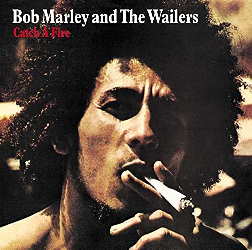 Bob Marley with an afro, smoking a cigarette, on the Catch A Fire album cover.