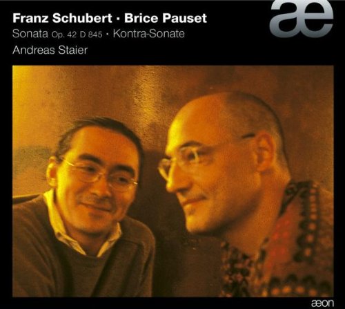 "CD cover with two men and text describing the music content."