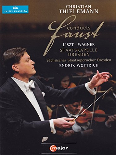Conductor Christian Thielemann in tuxedo, holding baton, with orchestra musicians in the background.
