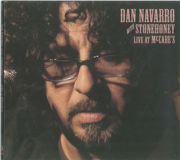 CD cover featuring Dan Navarro in glasses, close-up portrait.