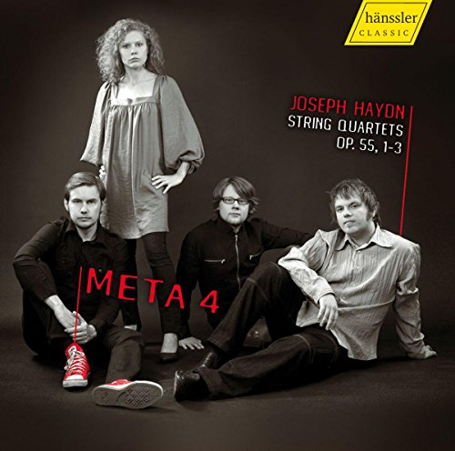 "CD cover featuring four musicians, three seated, one standing, against a dark background."