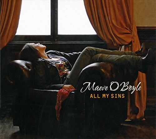 "Album cover featuring a person reclining on a couch, with artist and title text."