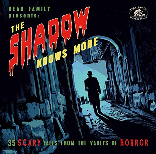 CD cover for "The Shadow Knows More" featuring a man in a dark alley.