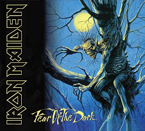 "Iron Maiden album cover featuring a monster in a twisted tree under a full moon."
