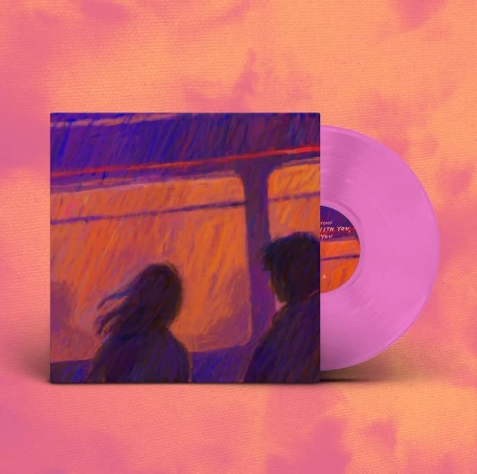 Vinyl record and album cover with painted figures by a window.