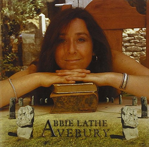 Abbie Lathe's album cover featuring a woman resting on ancient stones.