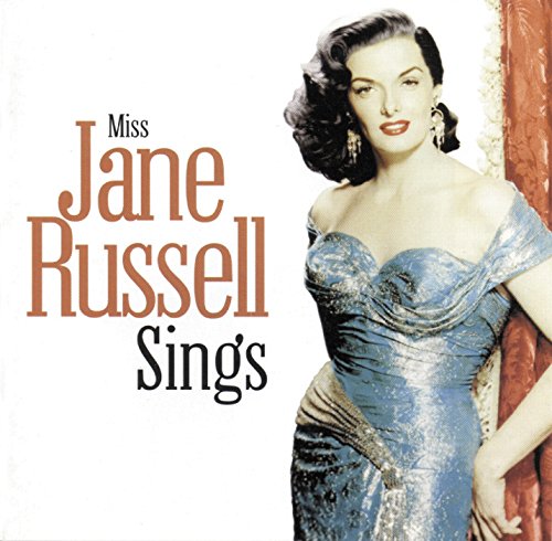"CD cover featuring Jane Russell in a blue dress, posing beside a red curtain."