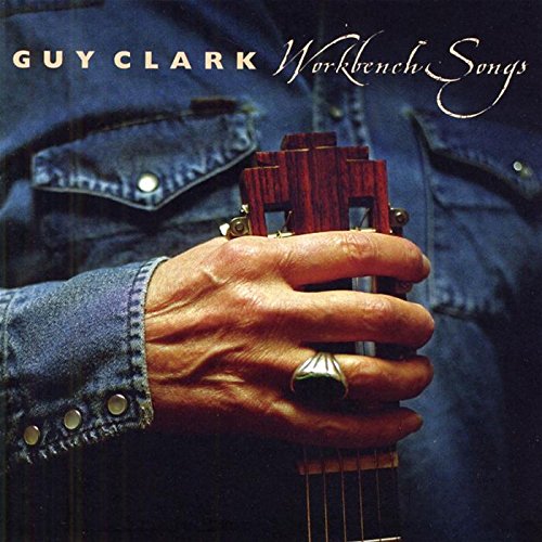 "Album cover with a hand holding a guitar neck, wearing a denim shirt."