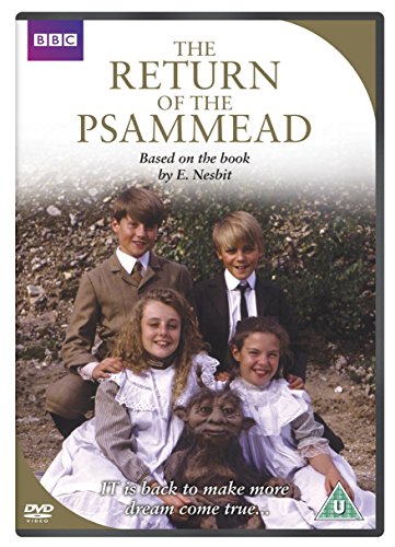 DVD cover featuring four children and a small, furry creature in a field.