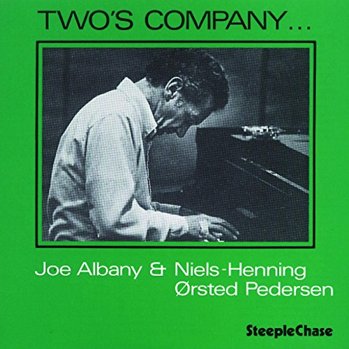 GreenLush green album cover withBBHHSPLSCCLCTLHHPH- a black and white photo of a man playing piano.