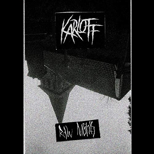 Black and white vinyl record cover with stark, angular graphic design.