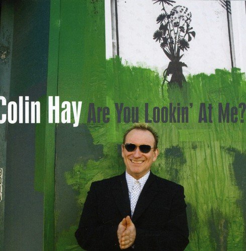 "Colin Hay album cover featuring a man in a black suit and sunglasses."