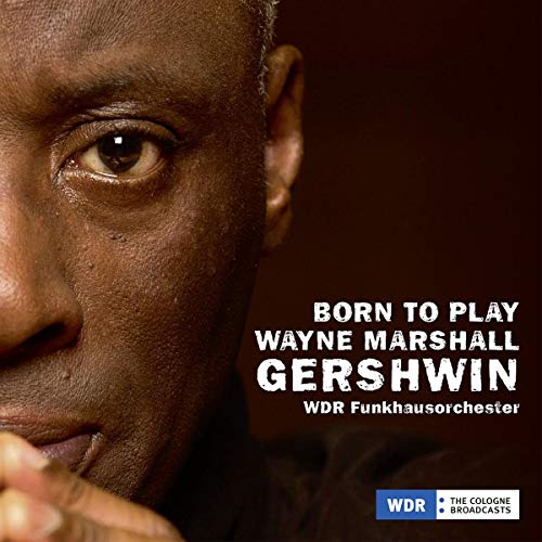 "CD cover with a close-up of a man's face and white text on dark background."