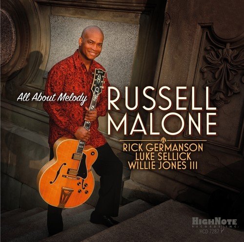 "Album cover featuring Russell Malone holding a guitar, wearing a red patterned shirt."