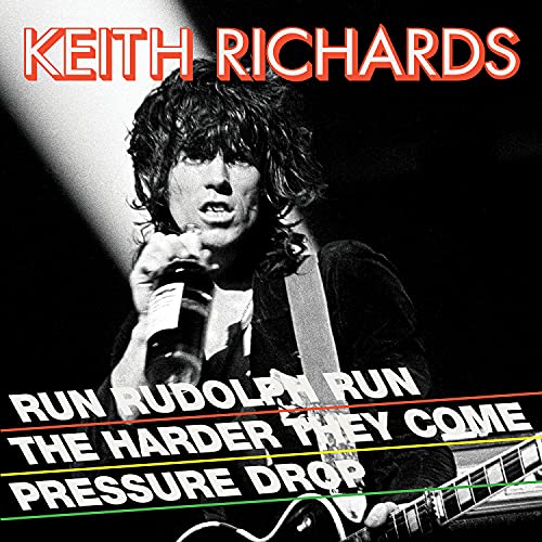 Black and white photo of Keith Richards performing with guitar and microphone.