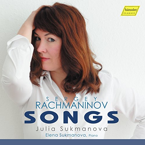 CD cover featuring a woman with red hair and a white shirt, text overlay.