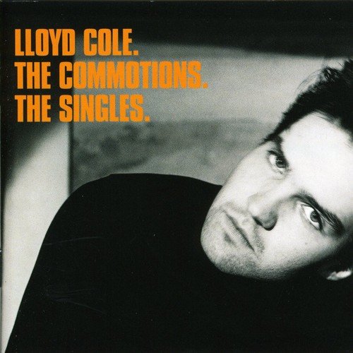 Black and white album cover with a man's portrait and orange text.